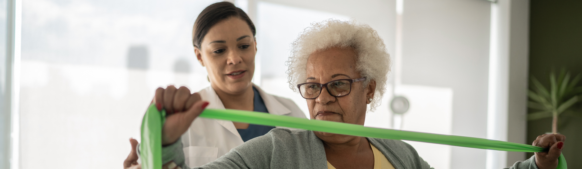 elderly woman getting physical therapy