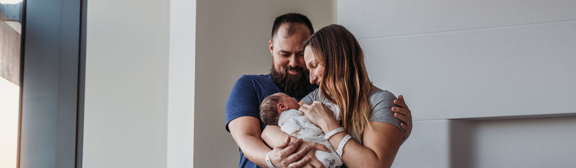 Father, Mother and Newborn Baby