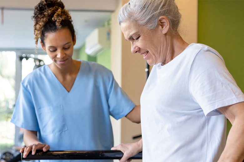 Nurse helping a patient walk